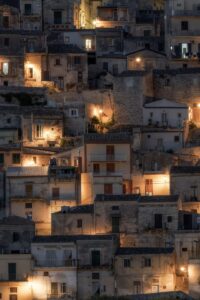 Old stone buildings illuminated at dusk